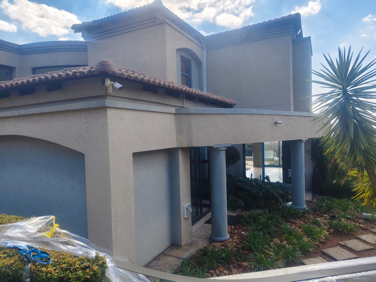 Tan House with Grey Columns